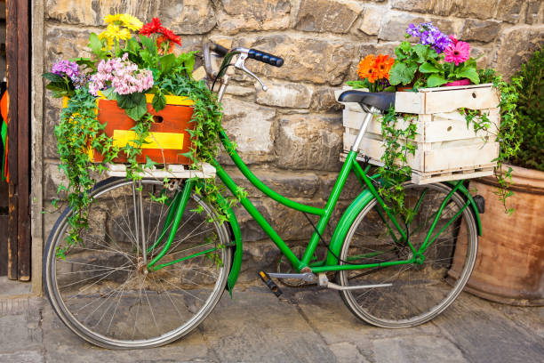 istock Green bicycle decorated with flowers parked in Florence 1164026484