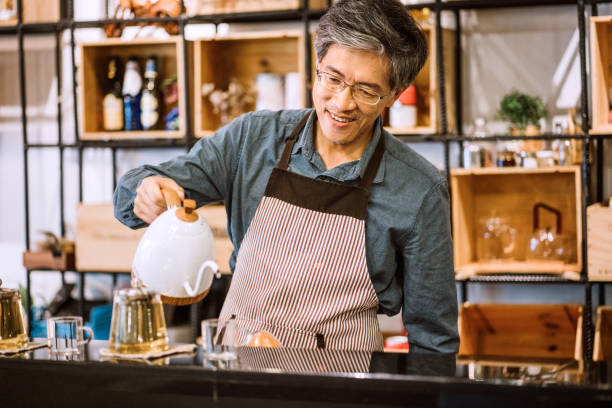 istock Proud Cafe Owner working in his cafe 1164027356