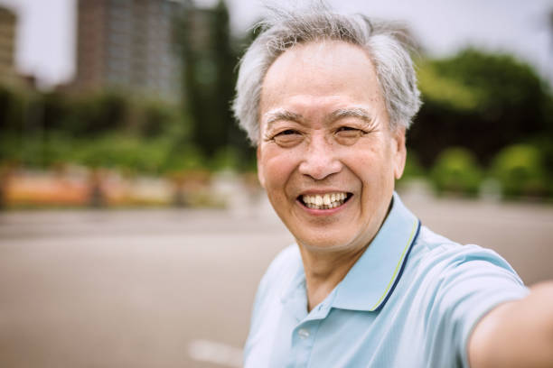 istock Happy Senior Man taking selfie 1164027478