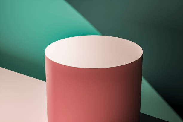 istock Pink circular podium against a pastel green wall 1164030402
