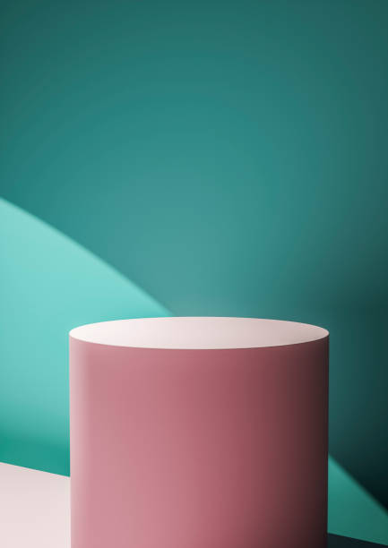 istock Pink circular display plinth against a green wall 1164030408