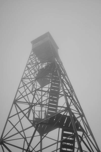 A photograph capturing a weather station perched on a hillside, equipped with instruments to measure and record atmospheric conditions.