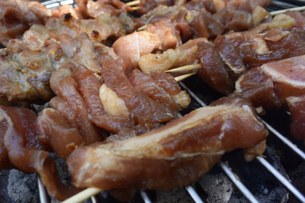 istock pork skewer in bamboo stick on the grill 1164035181