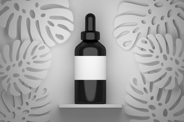 istock Black serum bottle with white empty label and Monstera leaves 1164036035