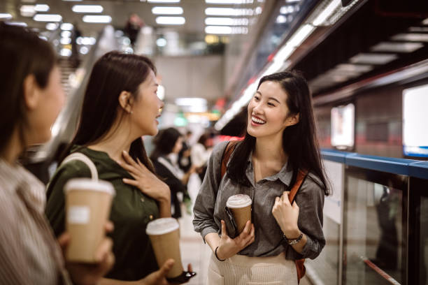 istock Beautiful Asian friends waiting for subway train 1164036049