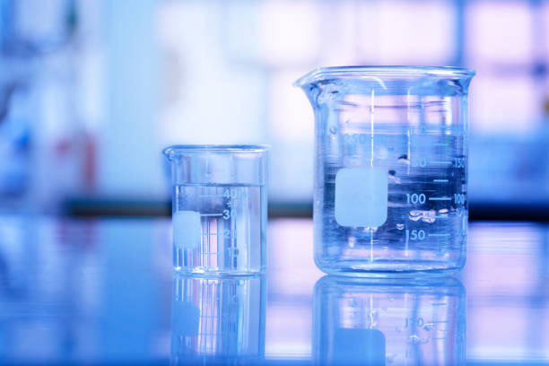 istock two glass beaker with water in blue medical science laboratory background 1164037932