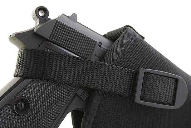 Handgun pistol .38 replica weapon in black holster.