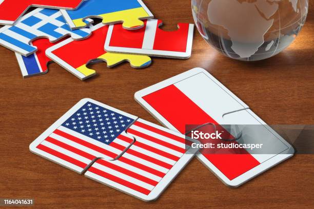 America And Poland Flags In Puzzle Stock Photo - Download Image Now - Poland, USA, Economy