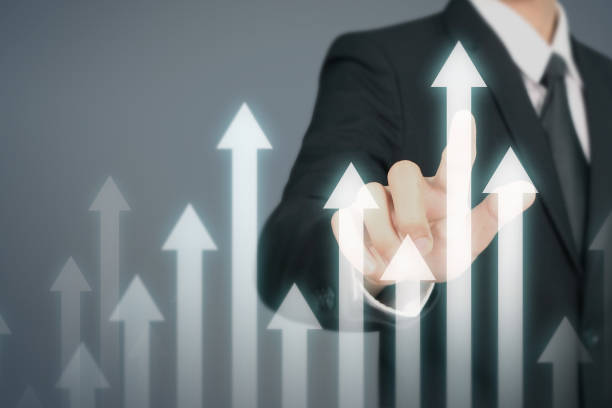 istock Businessman  Touching stock Graph Indicating Growth 1164042475