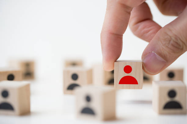 istock Job recruitment concept using icon people wood cube block 1164043329