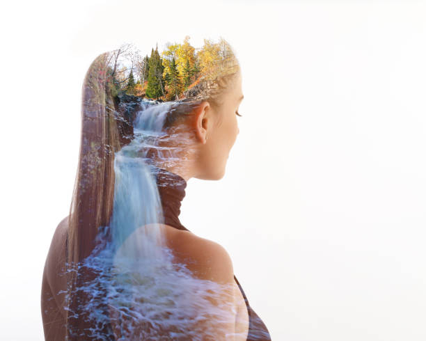 istock Multiple Exposure of young woman and waterfall 1164044631