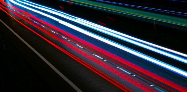 istock lights of cars with night 1164051939