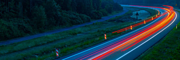 istock lights of cars with night 1164052588