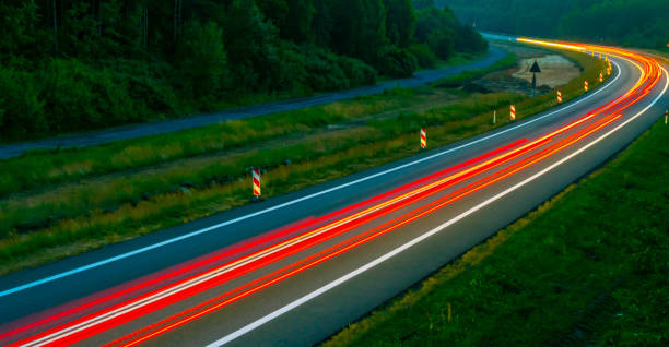 istock lights of cars with night 1164052717