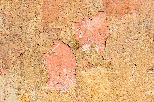 istock Texture of a concrete wall with cracks and scratches which can be used as a background 1164054689