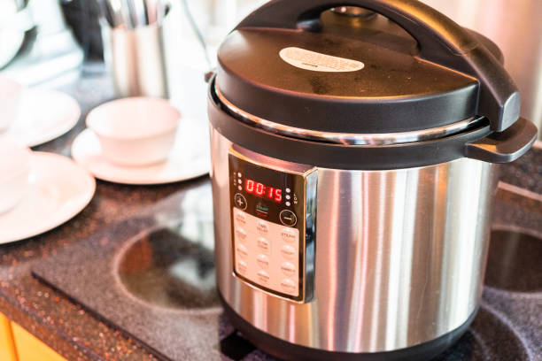 istock Cooking dinner in a pressure cooker in a modern kitchen. 1164054971