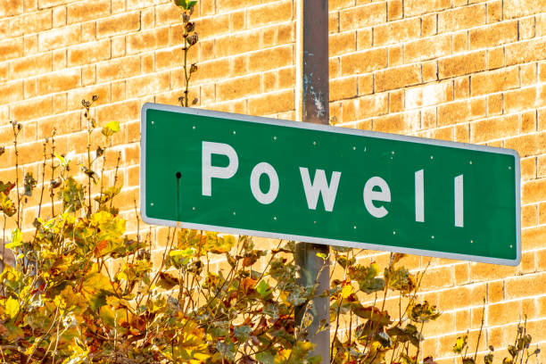 Powell street sign on pole in San Francisco, California. Powell street sign on pole in San Francisco, California. Brick wall building in background. major us cities stock pictures, royalty-free photos & images