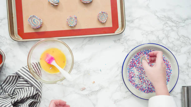 istock Rolling edges of red, white, and blue pinwheel sugar cookies 1164055965