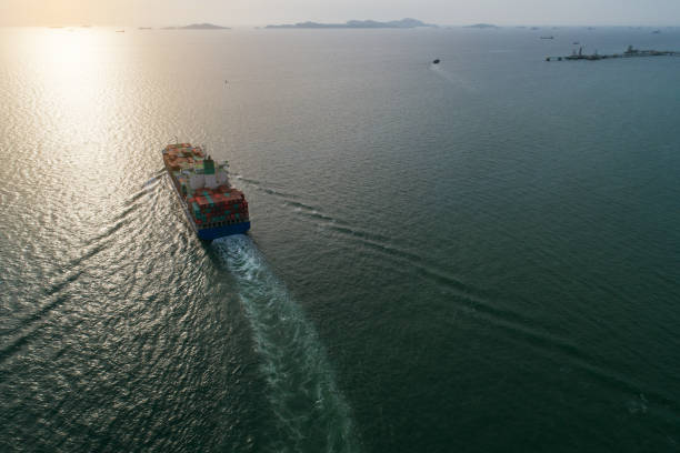 istock Aerial view container ship to sea port loading container for import export or transportation. shipping business logistic. Trade Port and Shipping cargo to harbor, International transportation. 1164056887