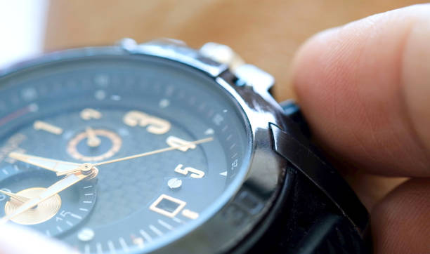 istock Man's hands. He looks at time and power. Use the time counter 1164056918