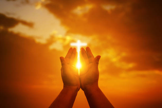 istock Human hands open palm up worship. Eucharist Therapy Bless God Helping Repent Catholic Easter Lent Mind Pray. Christian Religion concept background.Fighting and victory for god.people prayer at sunset 1164057001