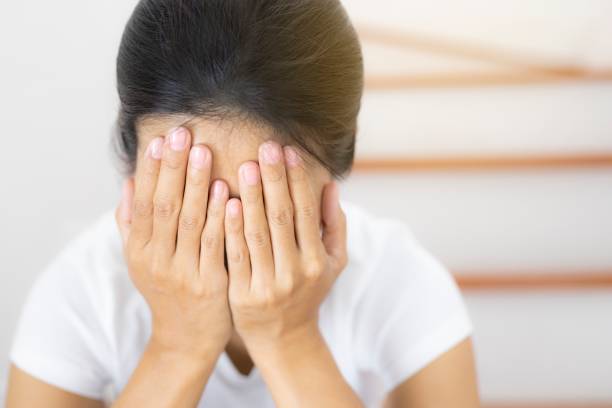 istock The depression woman alone sitting on staircase. 1164058091