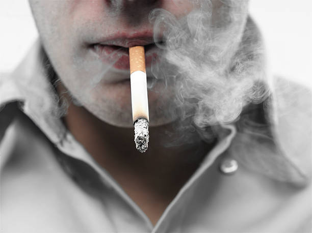 guy smoking a cigarette stock photo