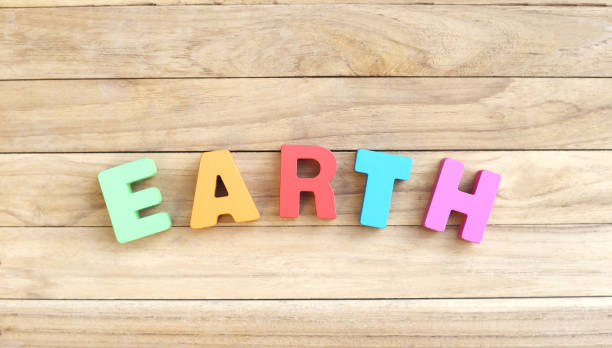 istock Colorful Word ' EARTH ' on Wooden Table 1164061850