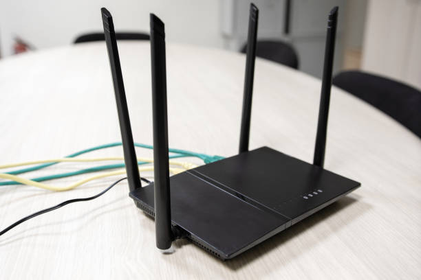 istock cable scattered on the table in the router with home Internet in the room 1164063693