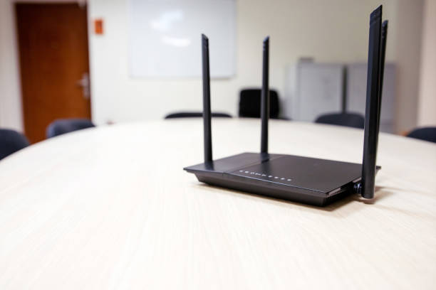 istock black router with four antennas for wifi on a light wooden table 1164063694