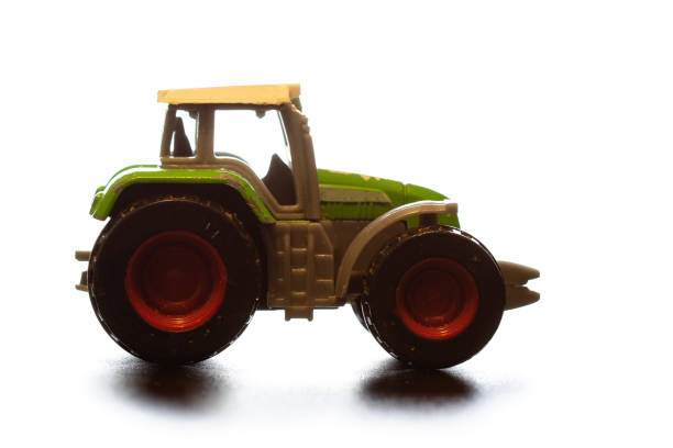 istock toy tractor on a light background with wear elements on the body 1164063713