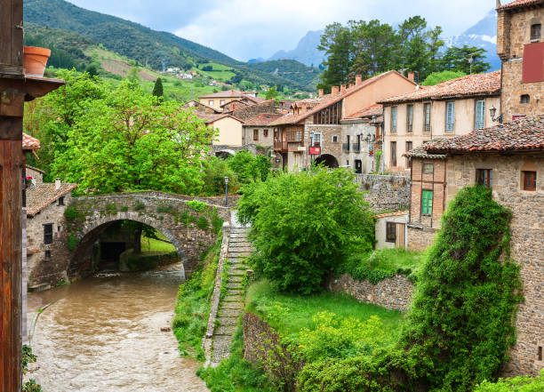 istock River Quiviesa, through San Cayetano bridge in Potes, Cantabria, Spain. 1164064977