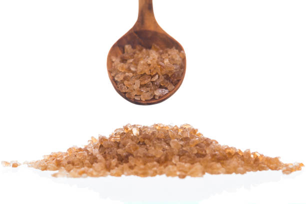 istock Brown rock sugar isolated on white 1164065395
