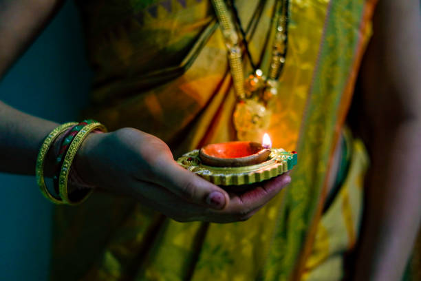 istock Indian Festival Diwali, lamp in hand 1164067178