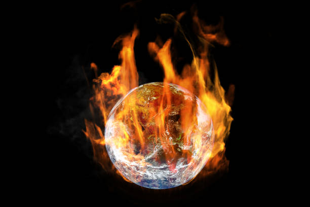 istock Global Warming and Pollution Concept : Fire burning planet earth globe isolated on black background. (Elements of this image furnished by NASA.) 1164068946