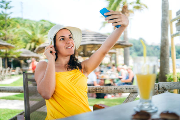 istock Young woman making selfies on vacation 1164074895