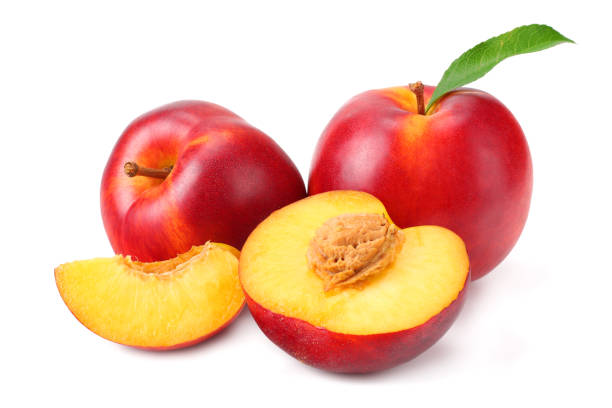 istock Nectarine with green leaf and slices isolated on white background 1164076688
