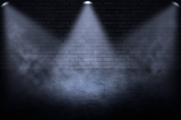 istock dark and grunge brick wall with spot light 1164077612
