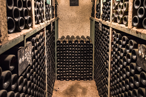 Vintage wine bottles in a cellar