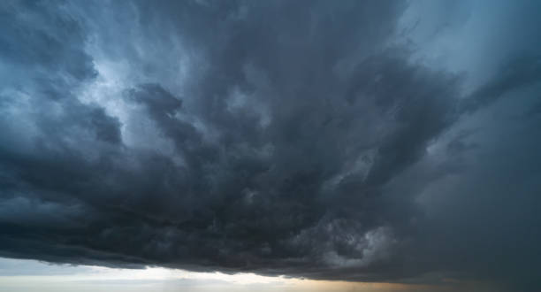 istock Dramatic rainy storm sky with dark fluffy clouds. Abstract nature background. 1164080327