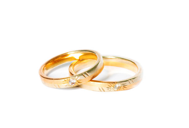 istock two golden wedding rings isolated on white, wedding rings background concept 1164081899