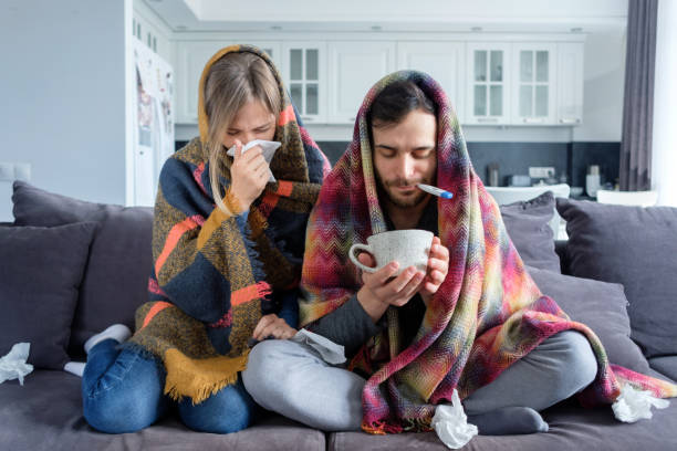 istock Couple is sick at home 1164082223