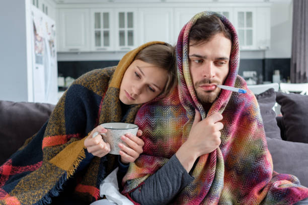istock Couple is sick at home 1164082263