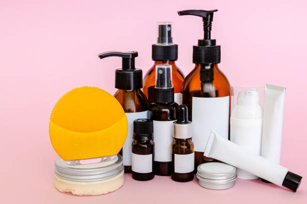 istock Cosmetic bottles with blank labels and cleansing brush 1164082311