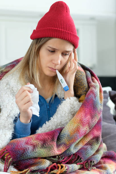 istock Girl is sick at home 1164082873