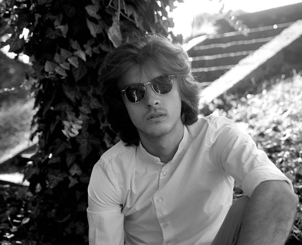 istock Young man in sunglasses outdoors 1164083270