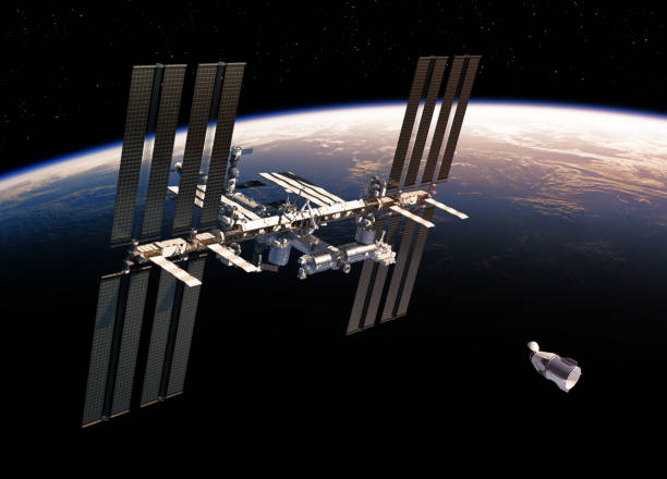 istock Commercial Spacecraft And International Space Station Orbiting Earth 1164083456