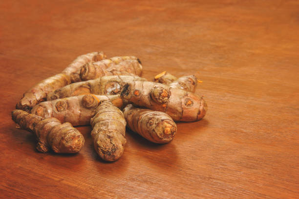 istock turmeric (curcuma) on wooden background 1164088203