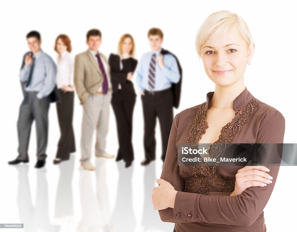 Business team Business team with young business woman in front. Achievement Stock Photo