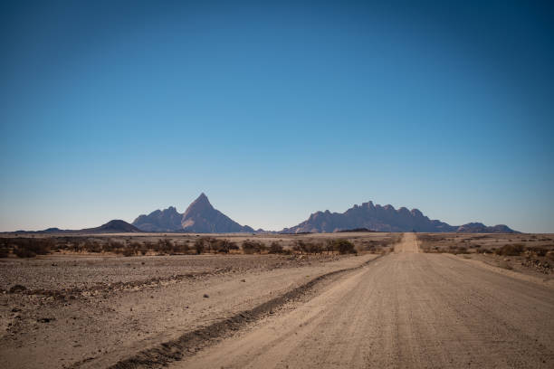 istock dirt road leading to Spitzkoppe 1164090378